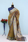 Has floral and peacock motifs on the zari border and pallu BROWN