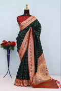 Has floral and peacock motifs on the zari border and pallu GREEN
